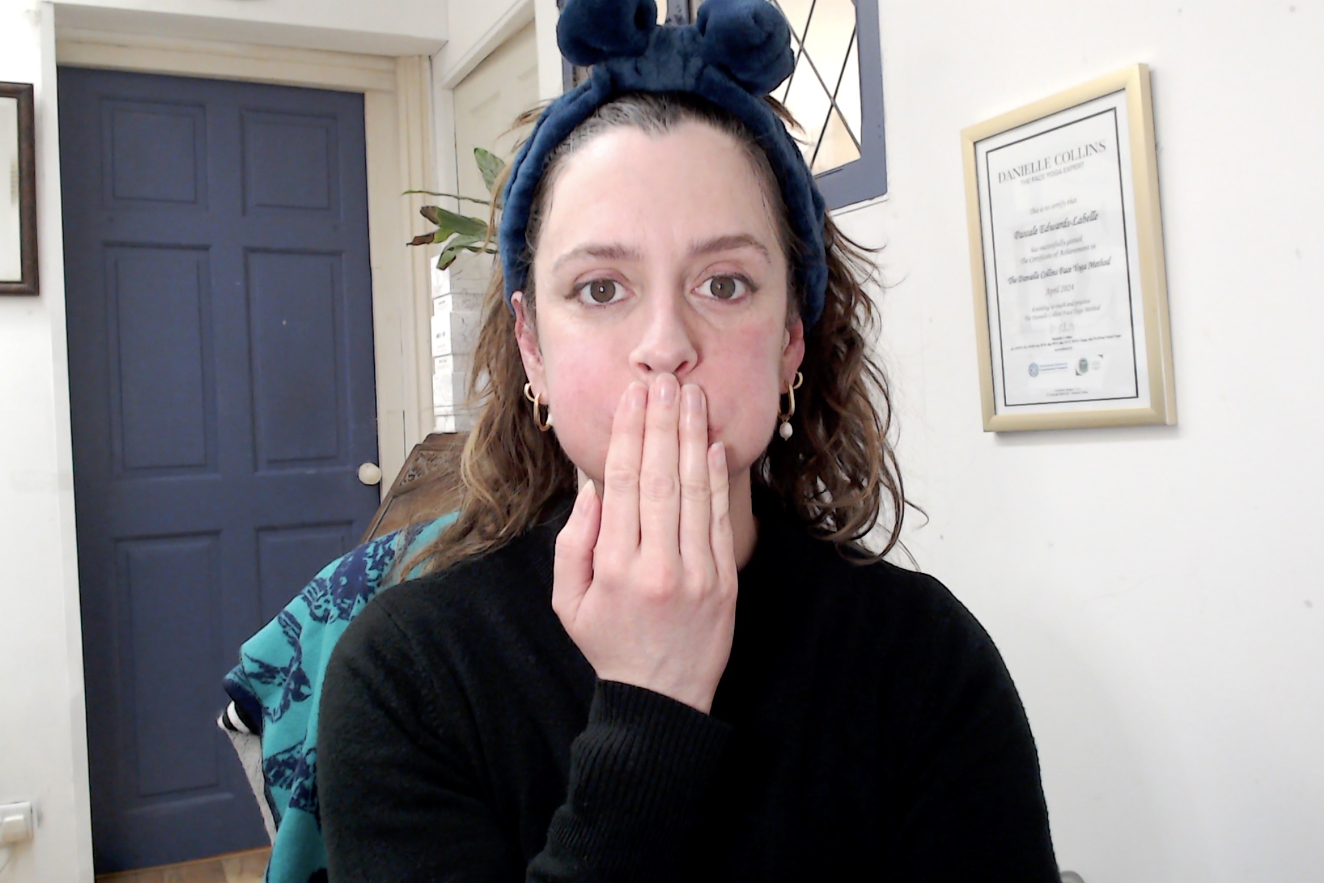 Pascale leading an online face yoga class - facial toning and massage